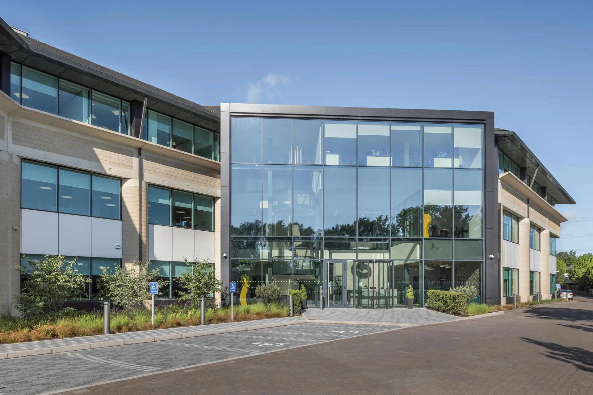 Modern office campus with glazed frontage and landscaped approach