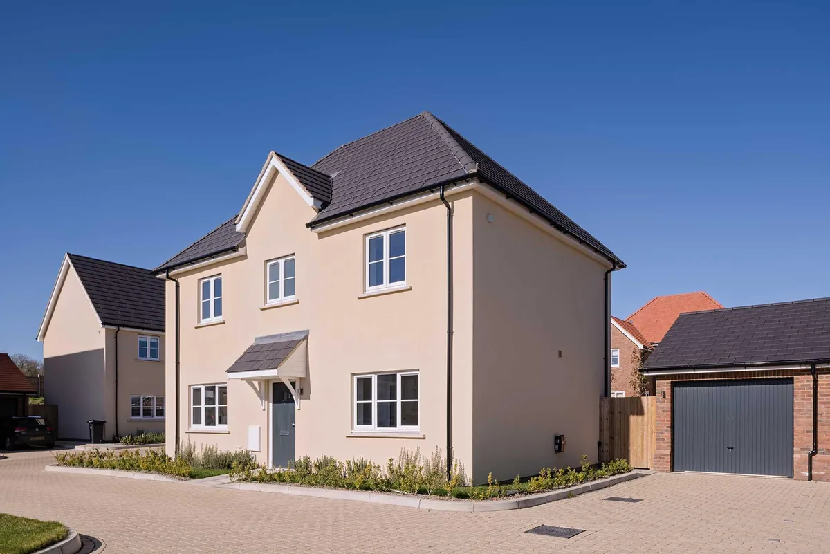 Pair of rendered new-build homes on a residential street